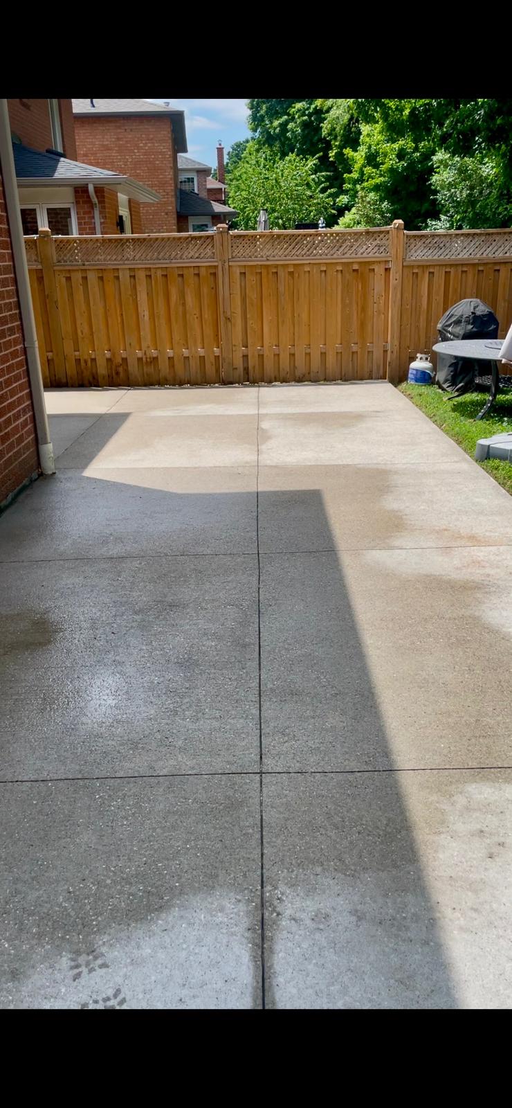 Pressure washed concrete patio, before and after